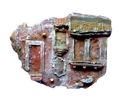 A bronze relief by Jan D'Esopo of a weathered architectural façade.